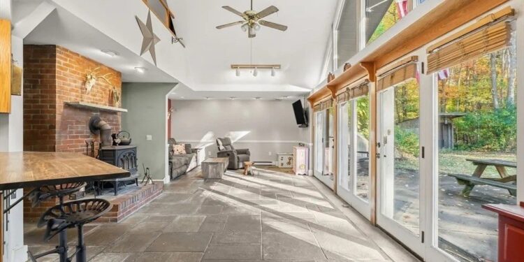 Earth-Sheltered Hobbit Home That Appears To Sink Into the Ground in Massachusetts Is Listed for Just $450K