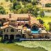 Dramatic Stone Villa Perched on the Edge of Horseshoe Bay Comes With Boat-In, Boat-Out Access